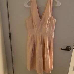 Peach colored wide- strap cocktail dress